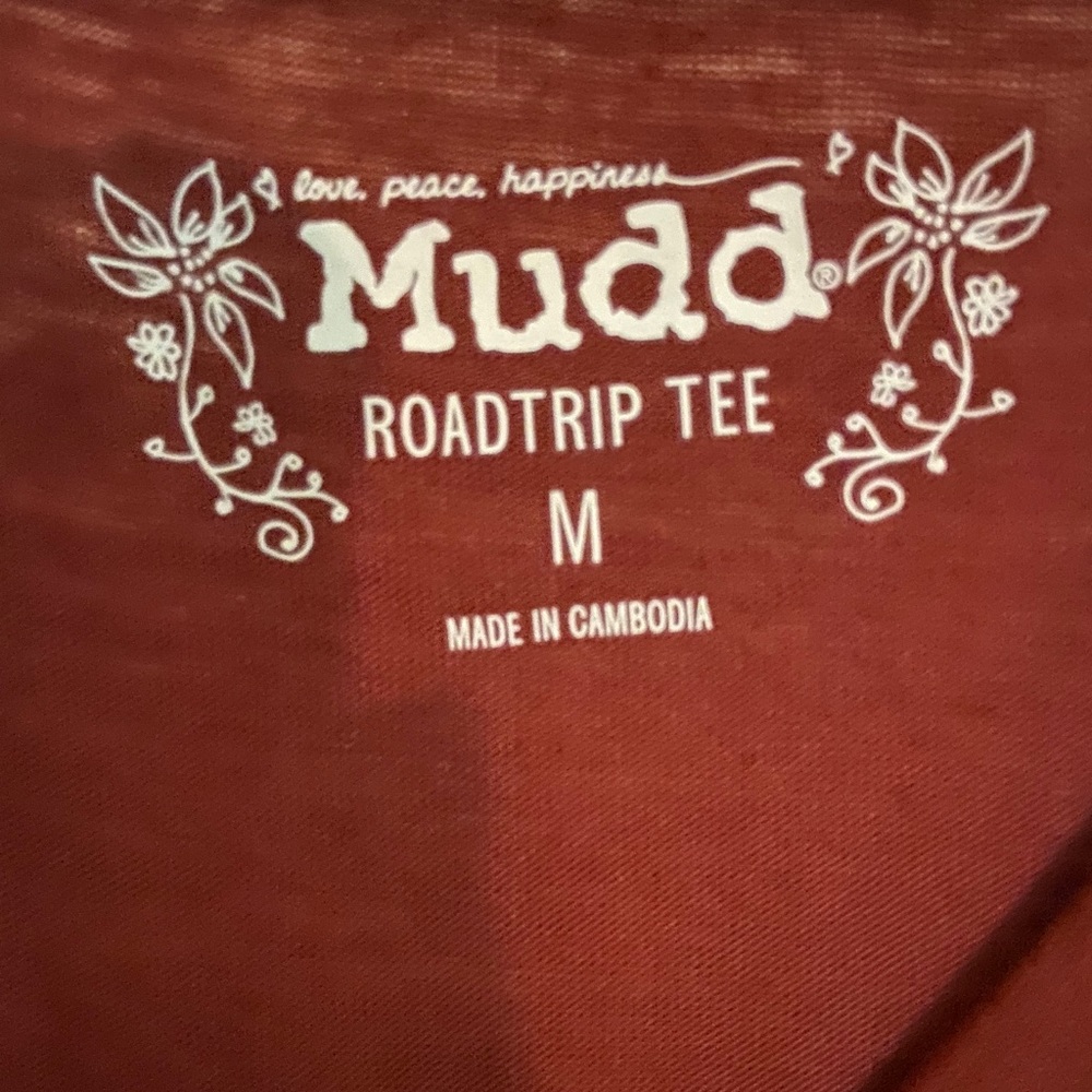 A rust v neck shirt